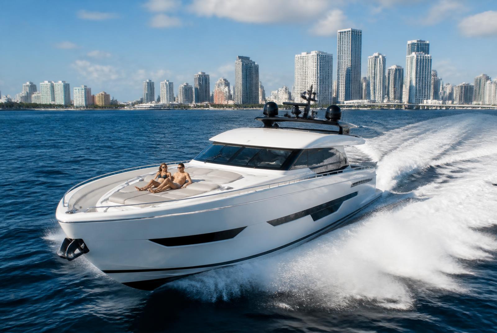 Modern white superyacht cruising past the Miami skyline on blue water